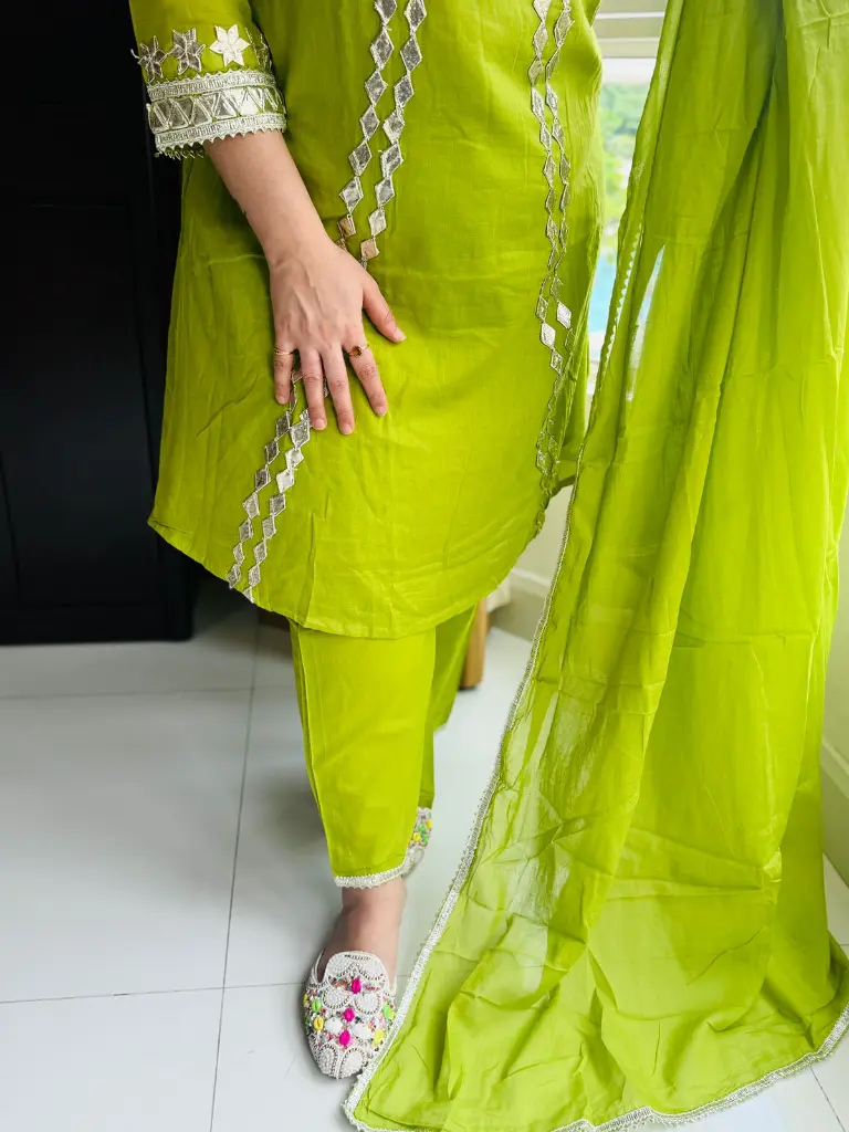 Green gota patti work A-line suit.webp